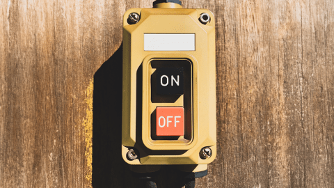 On/Off button mounted to a wood wall
