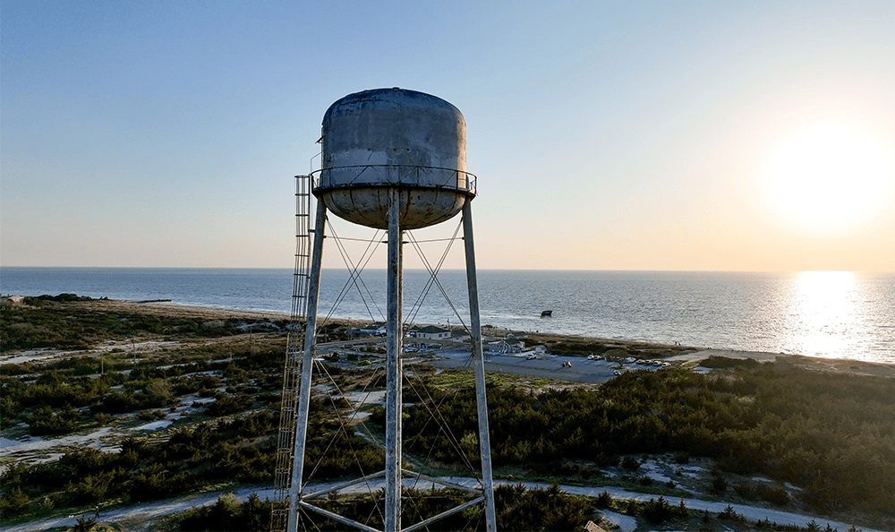 water tower overlooking a town on the coast